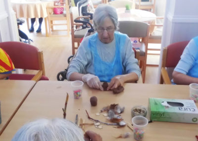 Woodstock residents making clay crafts with the children from Squirrel Nursery