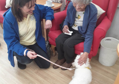 Pets As Therapy dog Lola ad owner Davina with a resident