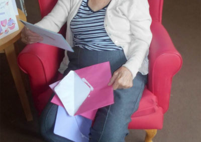 Lady resident reading her birthday cards