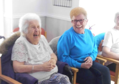Woodstock resident ladies smiling and listening to the Michel Bublé act