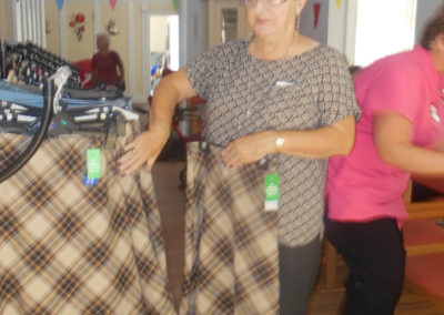 One of the ladies at Woodstock looking through Gemini Clothing's skirts