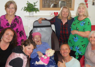 Resident surrounded by family members on her birthday
