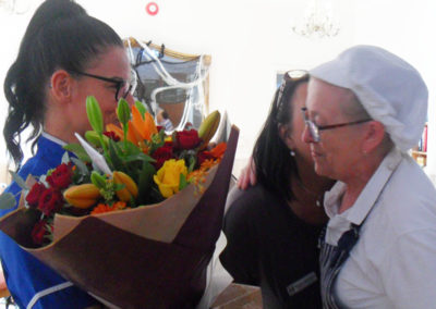 Kitchen Manager receiving flowers for long service