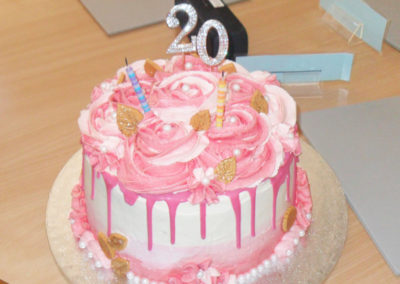 Pink iced 20 years long service cake