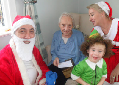 Father Christmas and his helpers visit Woodstock Residential Care Home