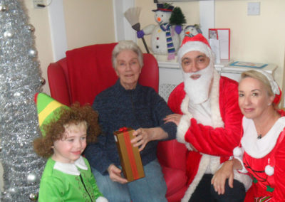 Father Christmas and his helpers visit Woodstock Residential Care Home