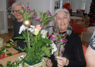 Making festive table flower decorations at Woodstock Residential Care Home