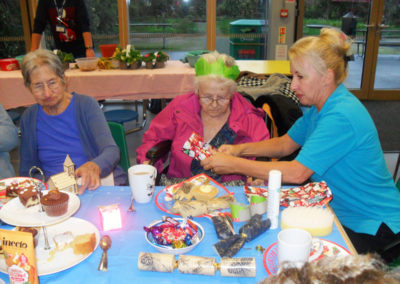 Staff and residents enjoying a Christmas party at the Oasis Cafe