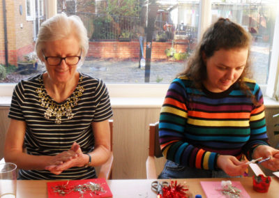 Woodstock resident and volunteer making Christmas cards together