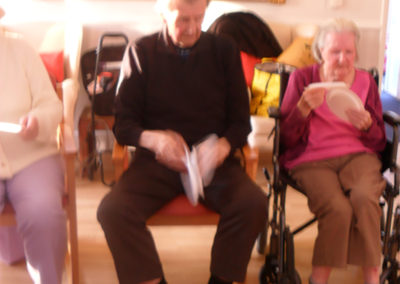 Male resident joining in with a Music for Health session