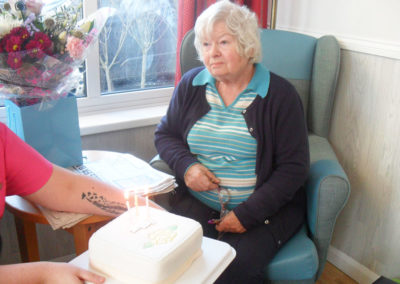 Woodstock resident receiving her iced birthday cake