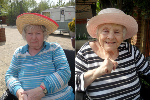 Two Woodstock Residential Care Home lady residents wearing sun hats in the garden