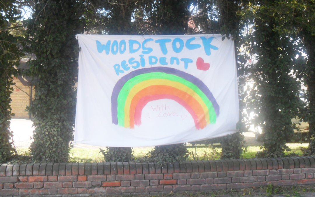 Woodstock Residential Care Home residents paint a rainbow to bring a smile