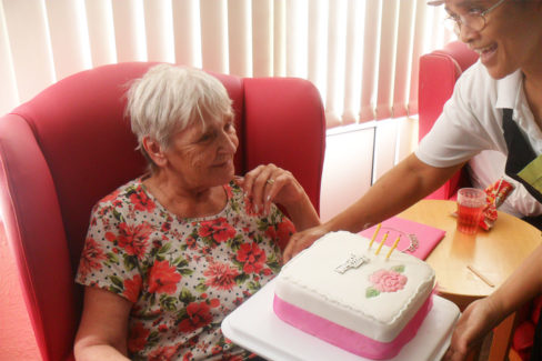 Woodstock Residential Care Home receiving her birthday cake