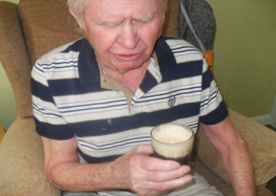Resident enjoying a glass of Guinness