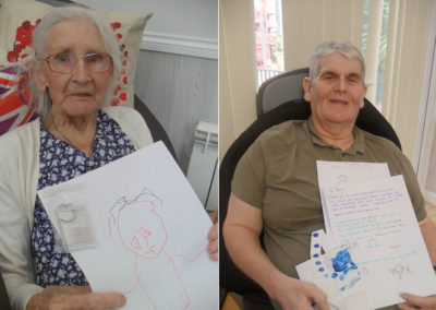Woodstock residents with pictures from nursery school pen pals