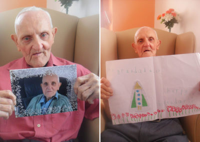 Resident with a card from family and a photo of himself