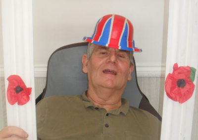 Woodstock Residential Care Home resident with a Remembrance photo frame