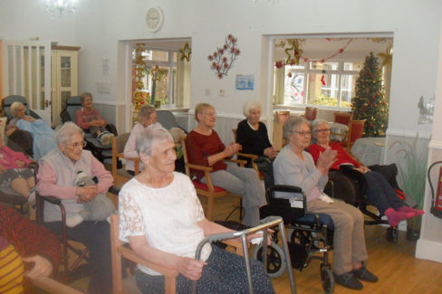 Residents enjoying a festive show at Woodstock Residential Care Home
