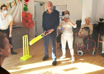 Woodstock Residential Care Home resident waiting to play a cricket shot
