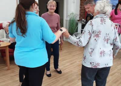 Woodstock Residential Care Home staff and residents dancing together
