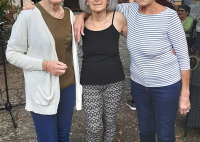 Three Woodstock Residential Care Home ladies posing together for a photo