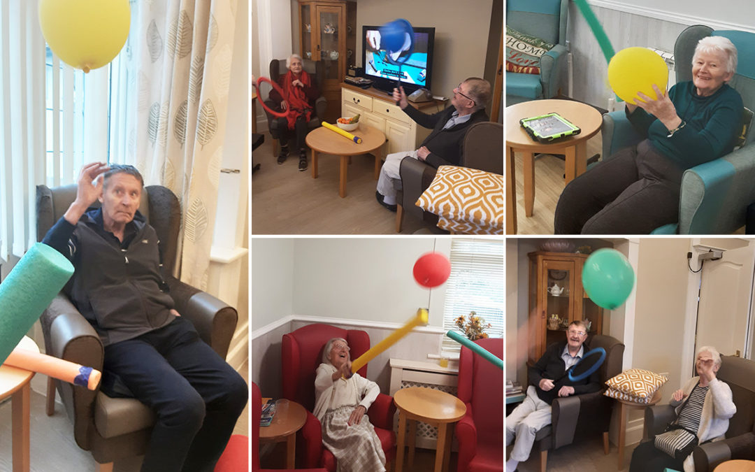 Cheerful balloon tennis at Woodstock Residential Care Home