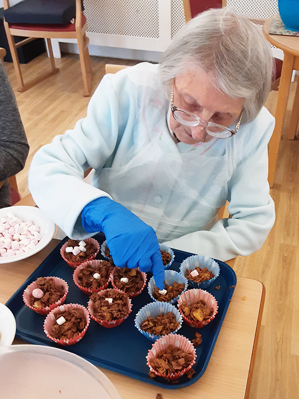 Woodstock Residential Care Home resident perfecting some Easter cakes