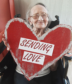 Woodstock Residential Care Home resident sending love with a photo