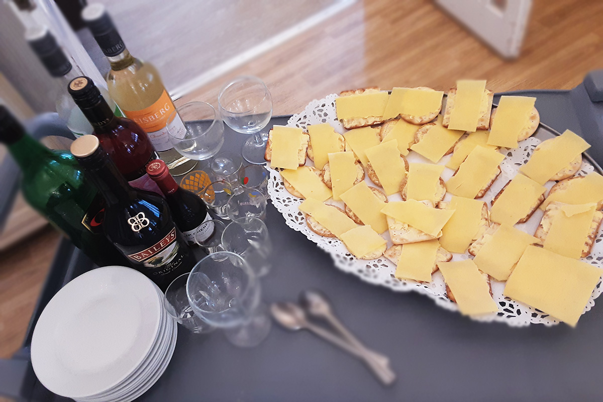 A spread of cheese and wine at Woodstock Residential Care Home