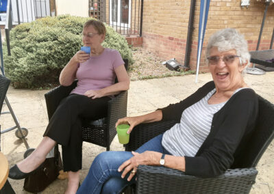 Socialising in the garden at Woodstock Residential Care Home