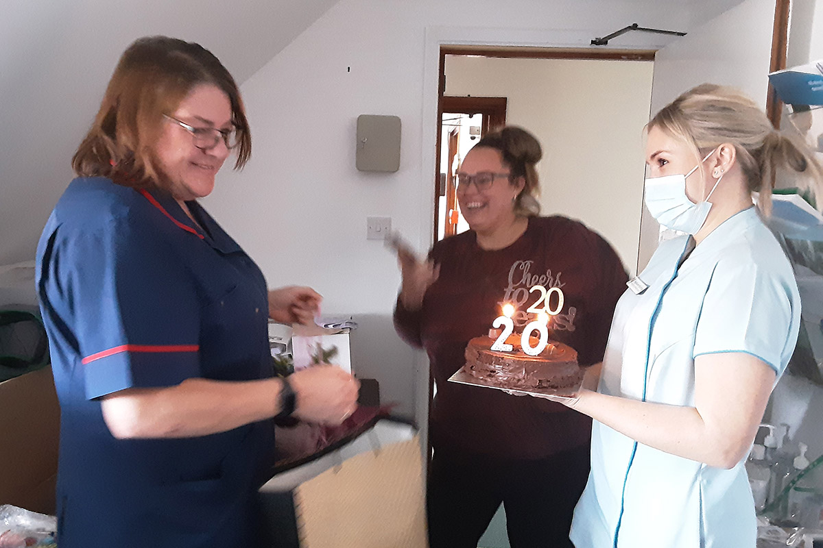 Paula celebrates 20 years at Woodstock Residential Care Home with cake and gifts