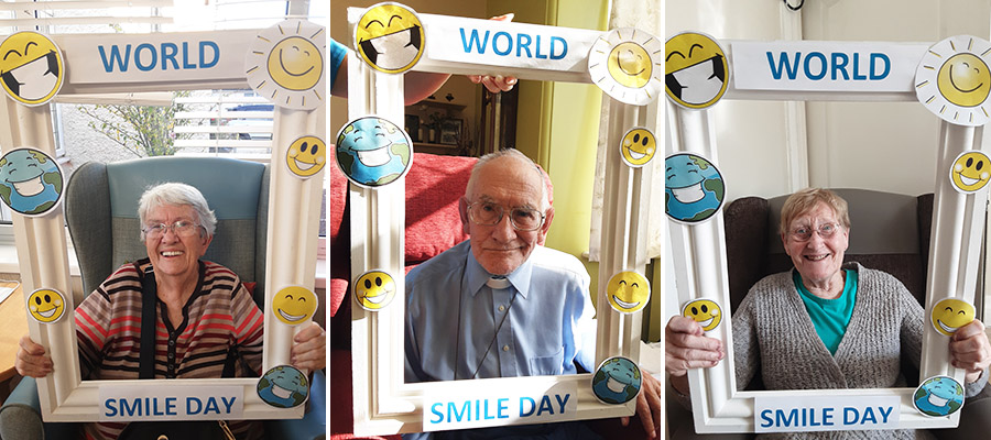 Woodstock Residential Care Home residents with a World Smile Day photo frame
