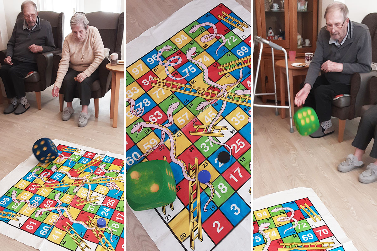 Woodstock Residential Care Home residents playing snakes and ladders 