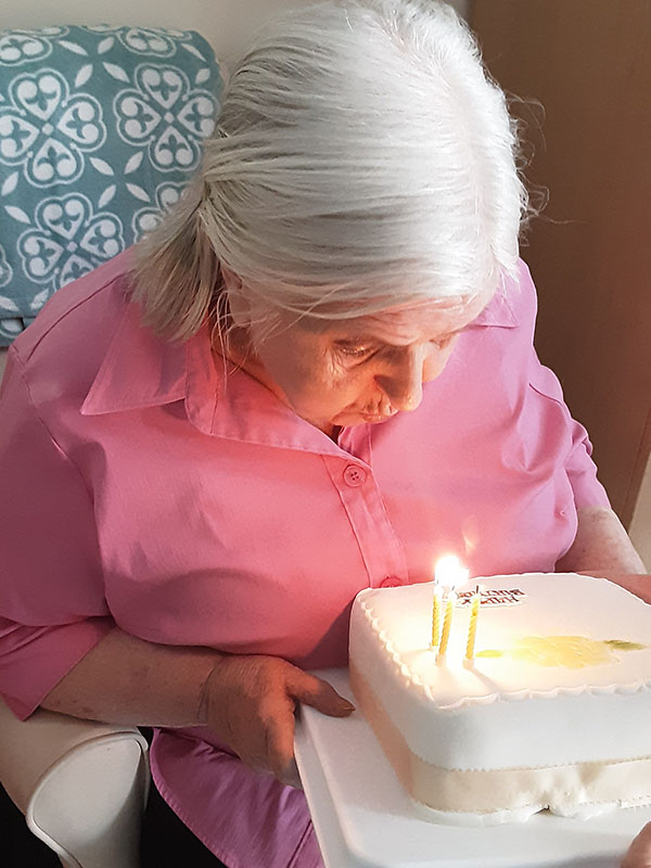 Kay with her birthday cake at Woodstock Residential Care Home 