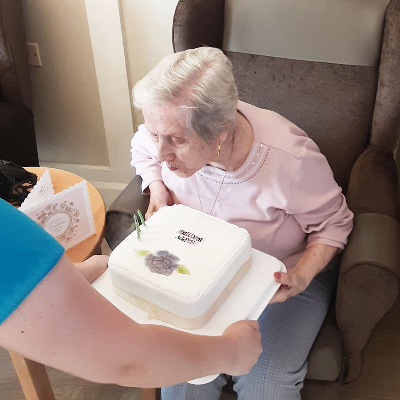 Gracie with her cake at Woodstock Residential Care Home