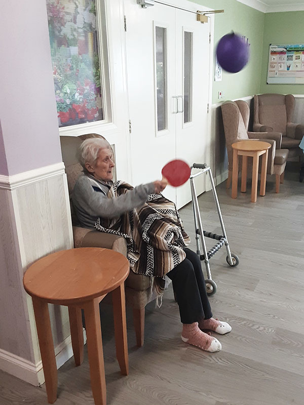 Woodstock Residential Care Home resident playing balloon tennis