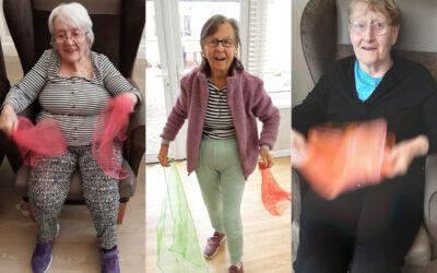 Light exercise with scarves to music at Woodstock Residential Care Home